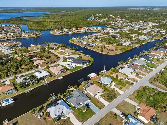 an aerial view of a houses with ocean view