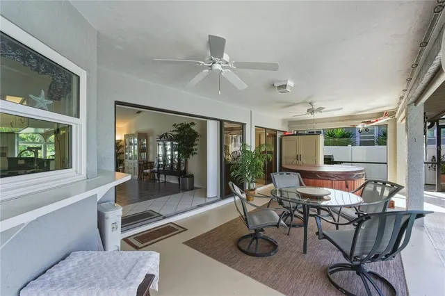 a dining room with furniture garden view and a chandelier