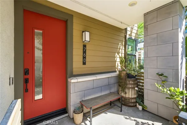 a view of entryway with wooden floor and stairs