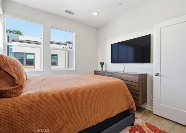 a bedroom with a bed and a couch