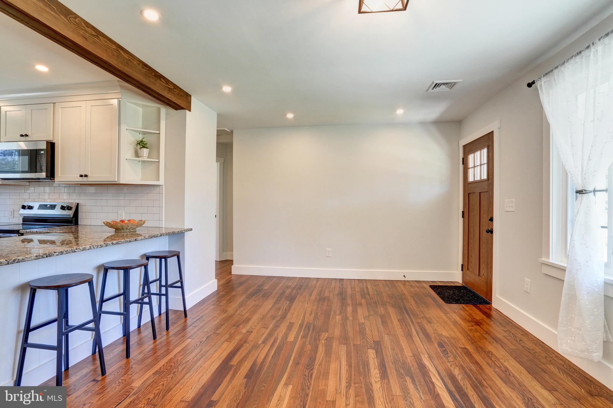 1312 Ship Road West Chester, PA 19380 - Photo 15 of 50 a kitchen with wooden floors and wooden cabinets