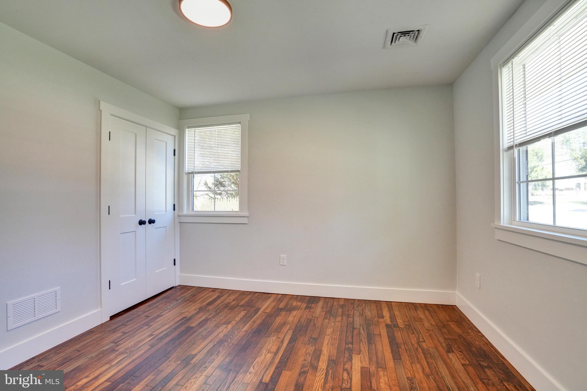 1312 Ship Road West Chester, PA 19380 - Photo 5 of 50 an empty room with wooden floor and windows