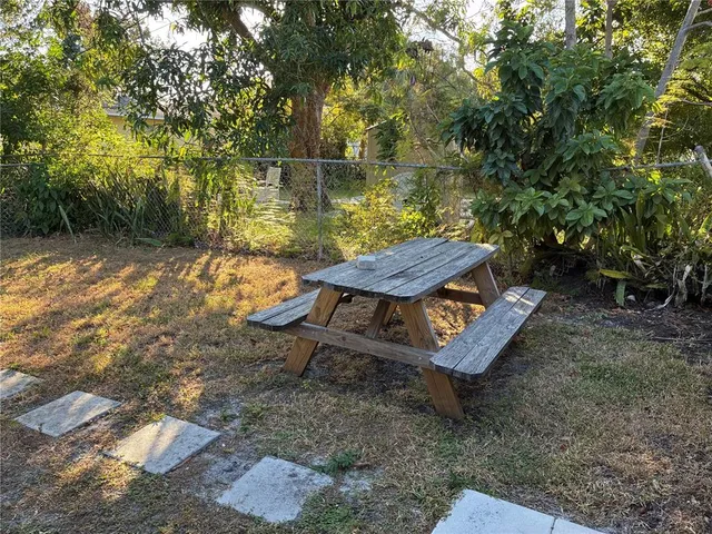 a view of a backyard with sitting area