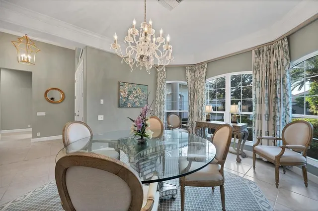 a living room with fireplace furniture and a chandelier