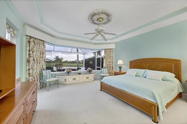 a bathroom with a tub a sink and mirror
