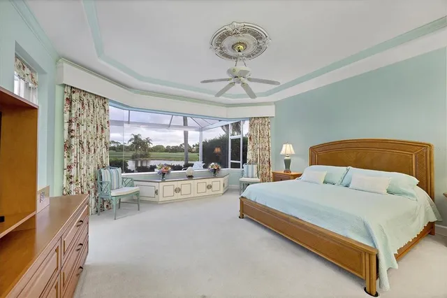 a bathroom with a tub a sink and mirror