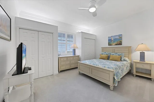 a kitchen with white cabinets and sink