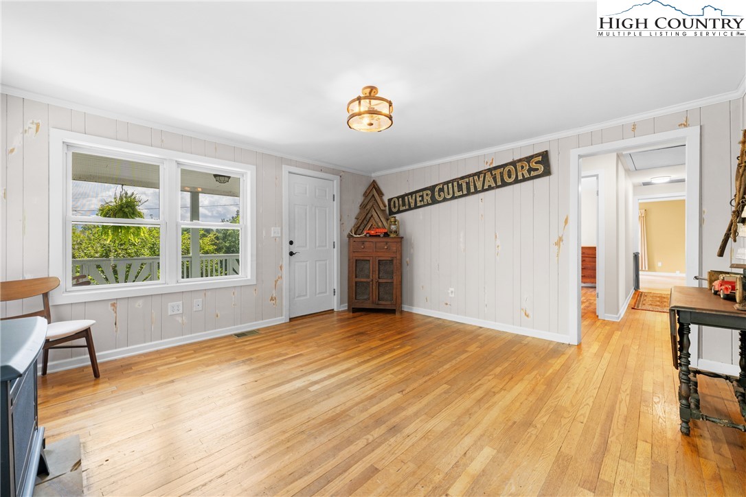 261 Tumbling Brook Road Banner Elk, NC 28604 - Photo 13 of 39 a view of empty room with wooden floor and fan