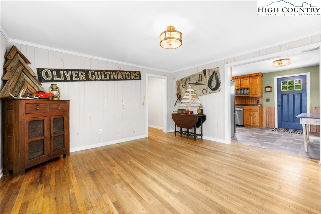 261 Tumbling Brook Road Banner Elk, NC 28604 - Photo 14 of 39 a view of an empty room with furniture and wooden floor