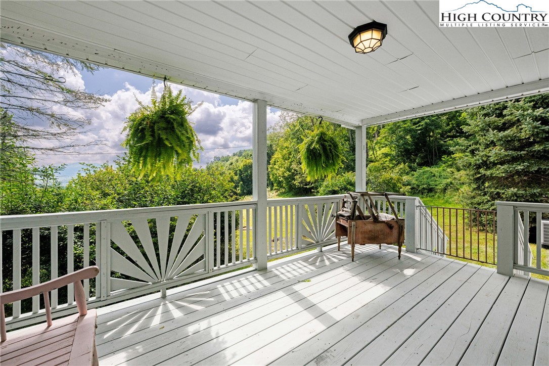 261 Tumbling Brook Road Banner Elk, NC 28604 - Photo 29 of 39 a view of balcony with furniture and wooden floor
