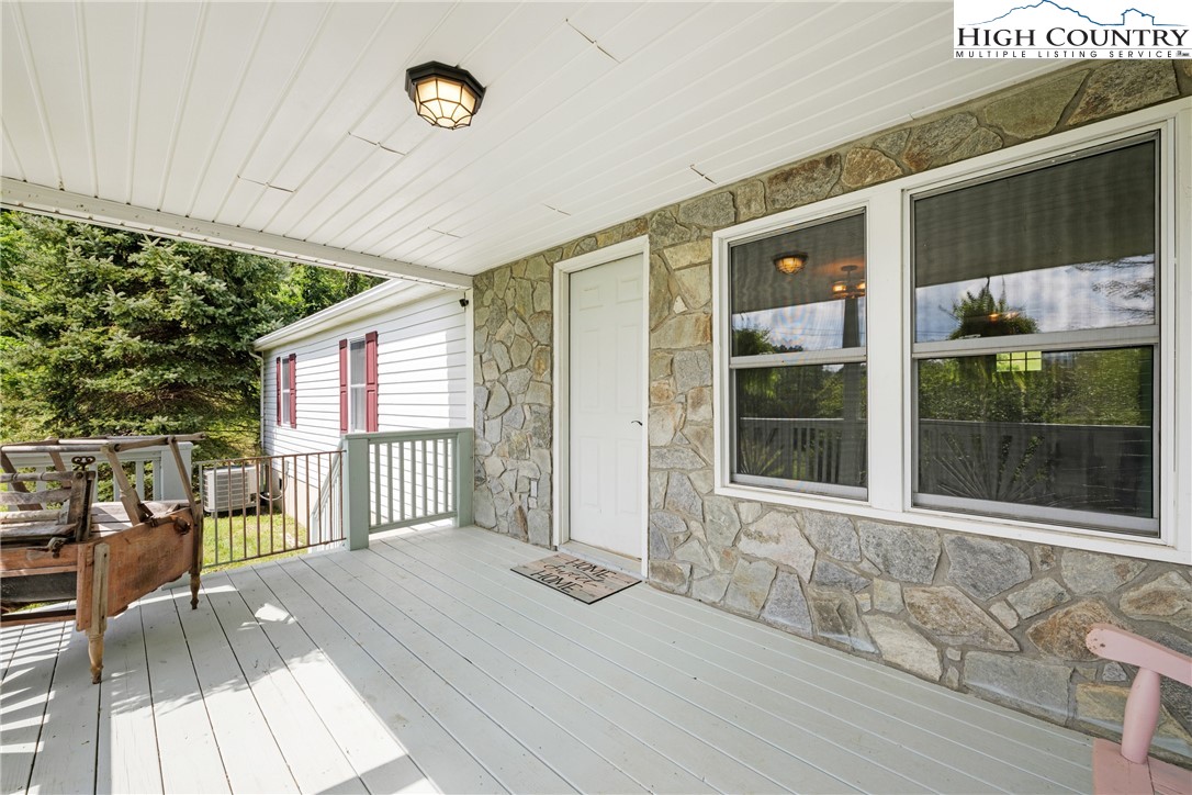 261 Tumbling Brook Road Banner Elk, NC 28604 - Photo 30 of 39 a view of a house with a porch