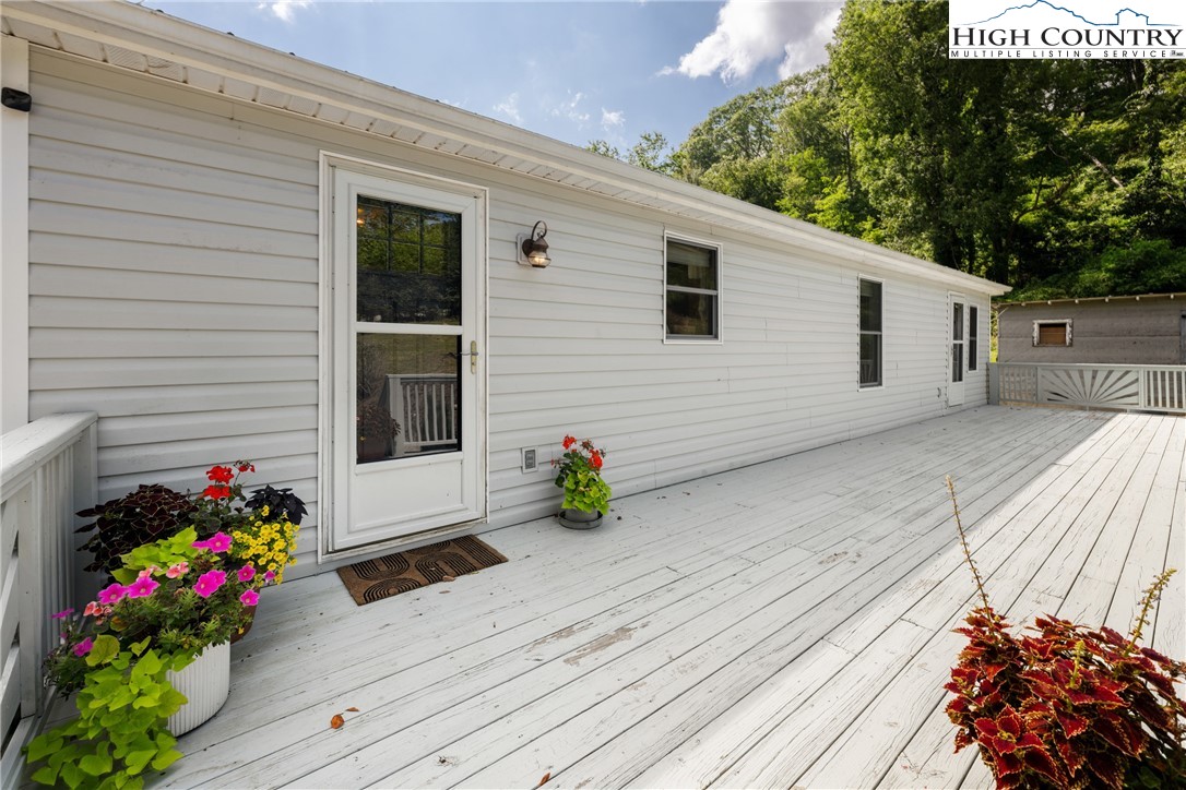 261 Tumbling Brook Road Banner Elk, NC 28604 - Photo 31 of 39 a view of a house with a yard