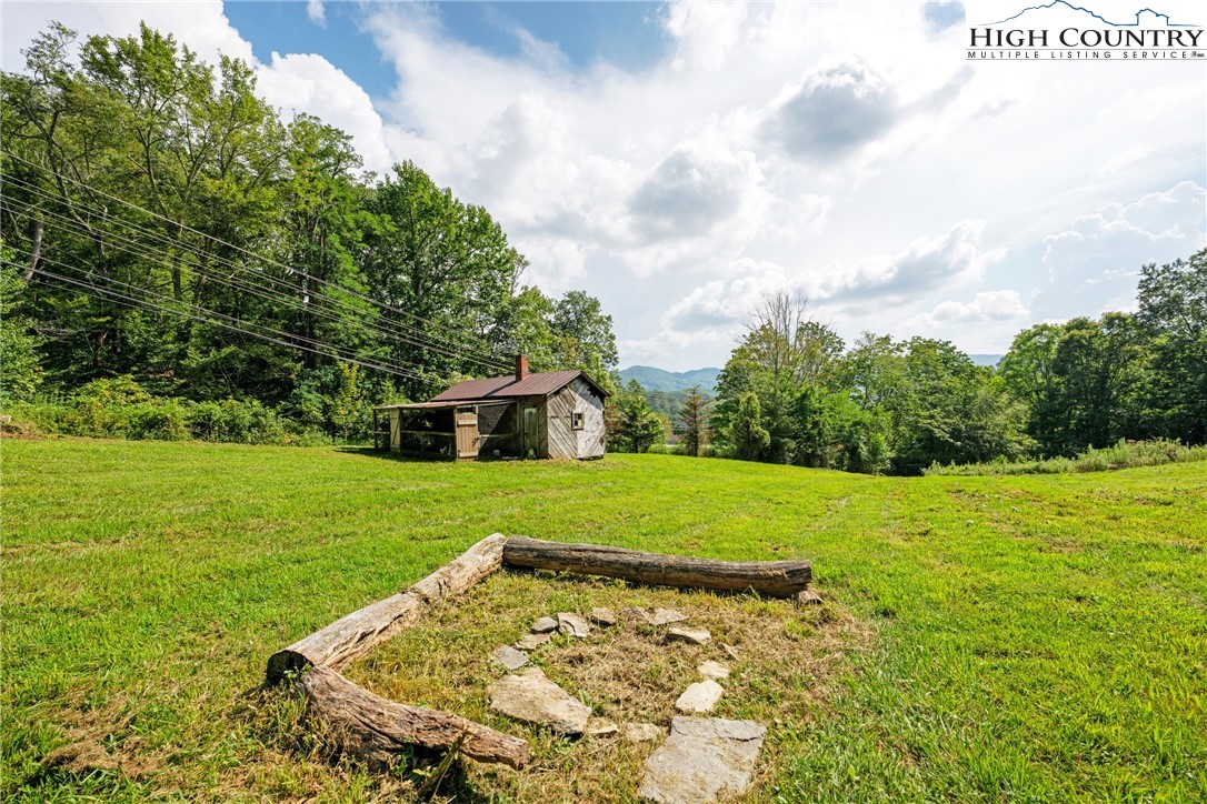 261 Tumbling Brook Road Banner Elk, NC 28604 - Photo 38 of 39 a view of a backyard with large trees