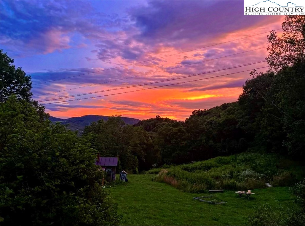 261 Tumbling Brook Road Banner Elk, NC 28604 - Photo 39 of 39 a view of a lake with a mountain in the background