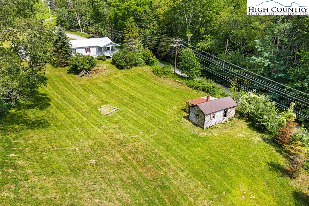 261 Tumbling Brook Road Banner Elk, NC 28604 - Photo 4 of 39 a view of a swimming pool with a yard