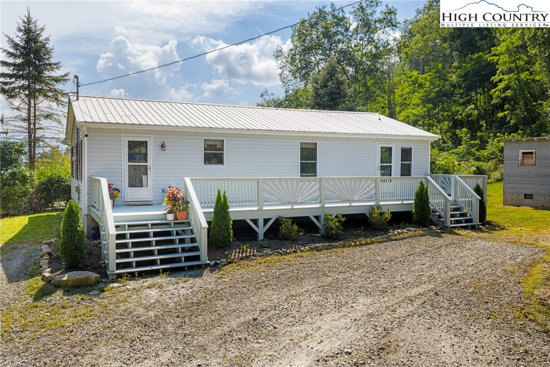 261 Tumbling Brook Road Banner Elk, NC 28604 - Photo 7 of 39 a view of a house with backyard and sitting area