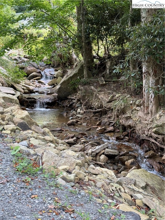 261 Tumbling Brook Road Banner Elk, NC 28604 - Photo 9 of 39 a view of a lake with lots of trees