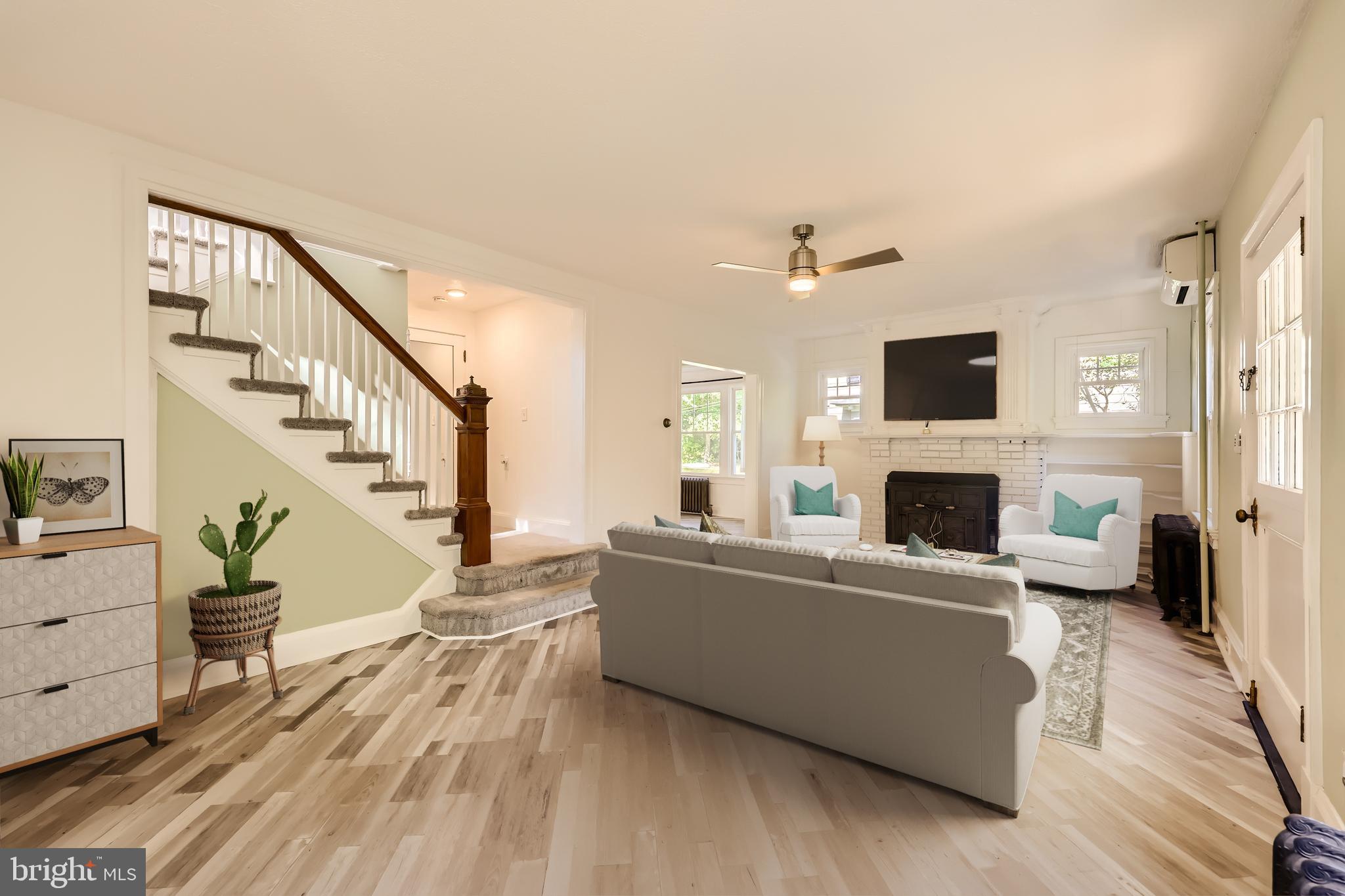 105 East Maple Road Linthicum Heights, MD 21090 - Photo 6 of 37 a living room with furniture and a fireplace