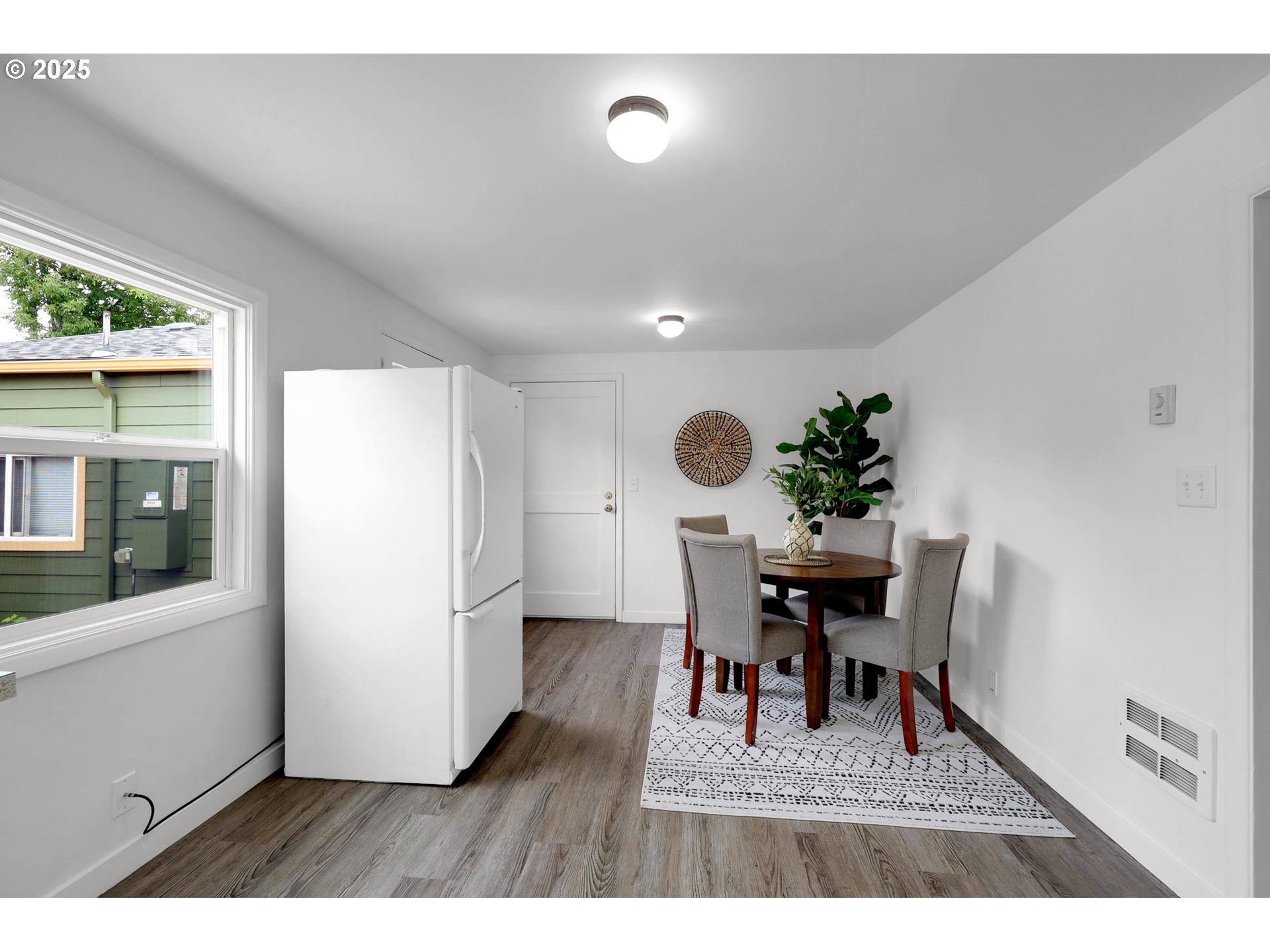 335 East 34th Avenue Eugene, OR 97405 - Photo 11 of 24 a dining room with furniture potted plants and wooden floor