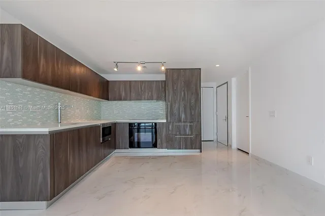 a view of a kitchen with cabinets