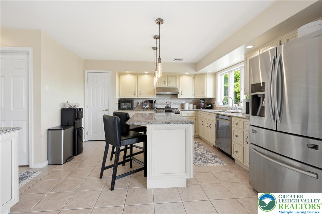 115 West Butternut Road Hellertown, PA 18055 - Photo 18 of 97 Granite counters and stainless steel appliances complete this bright and functional eat-in kitchen.