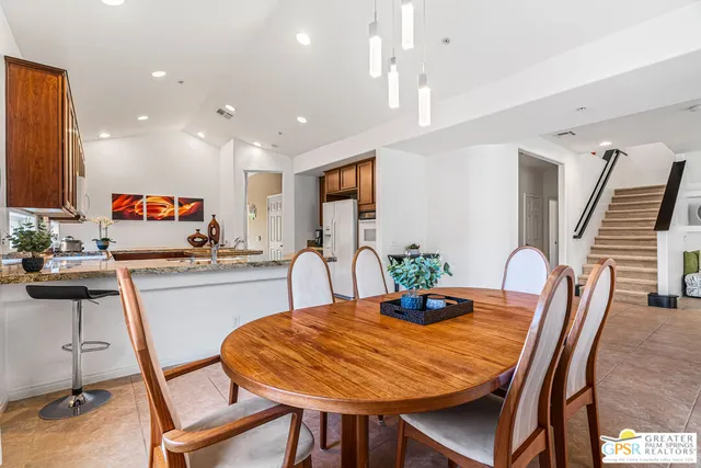 a bathroom with a granite countertop sink and mirror