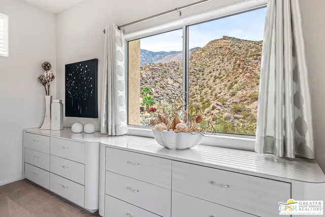 a view of a balcony with chairs