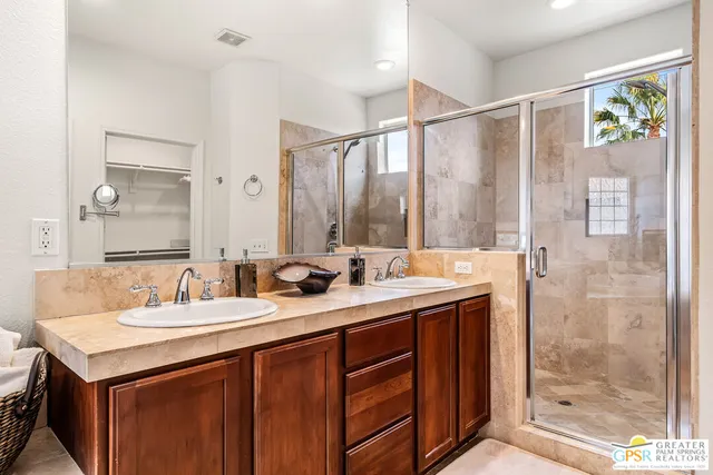 a view of a city with mountains in the background