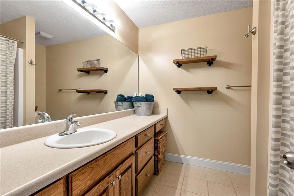 1044 Lothridge Road Cleveland, GA 30528 - Photo 27 of 40 a bathroom with a sink and a mirror
