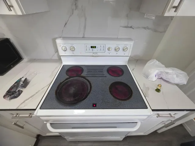 a room with a wooden floor and a window