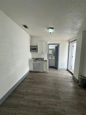 a white toilet sitting next to a bathroom sink