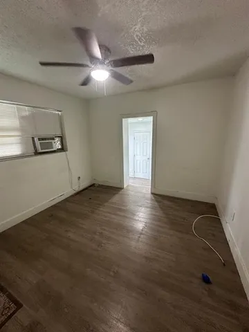 a bathroom with a sink shower and a mirror