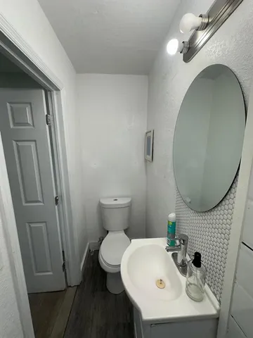 a kitchen with a sink window and cabinets