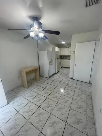 a view of a livingroom with a furniture