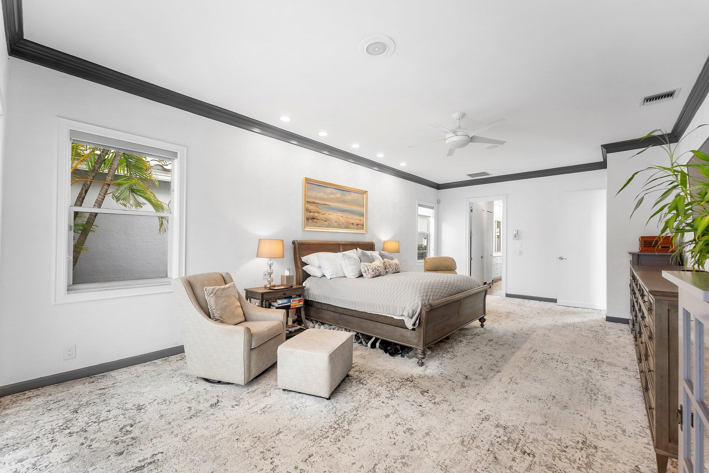 5863 Waterford Boca Raton, FL 33496 - Photo 16 of 90 a spacious bedroom with a bed and a window