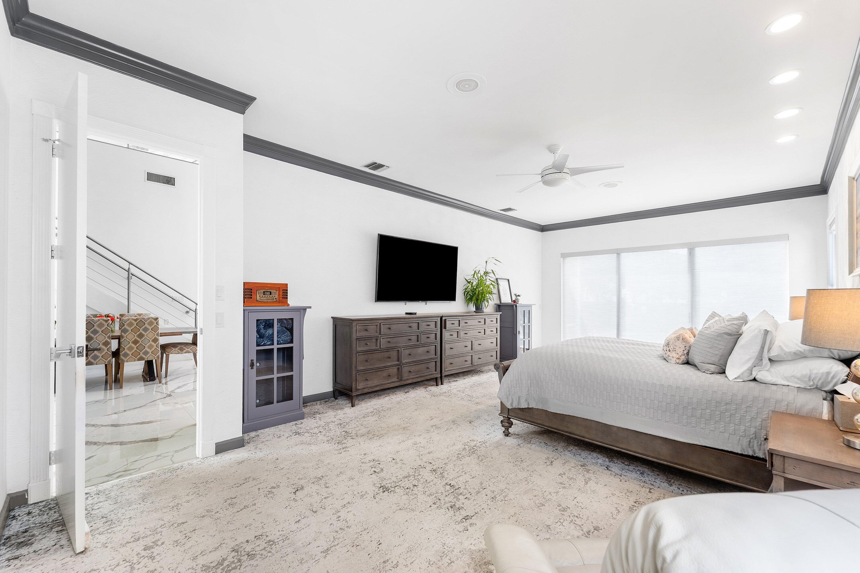 5863 Waterford Boca Raton, FL 33496 - Photo 17 of 90 a bedroom with a bed and a flat screen tv
