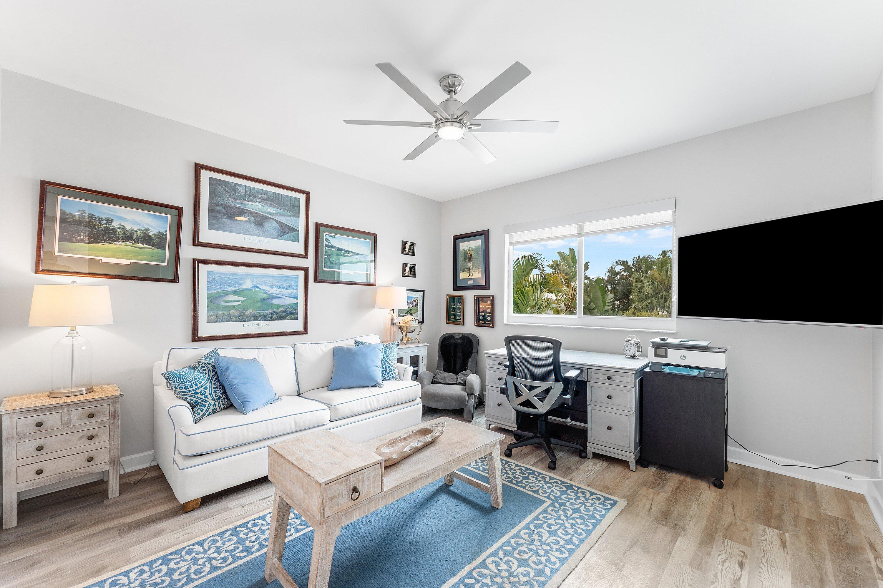 5863 Waterford Boca Raton, FL 33496 - Photo 20 of 90 a living room with furniture a flat screen tv and a window