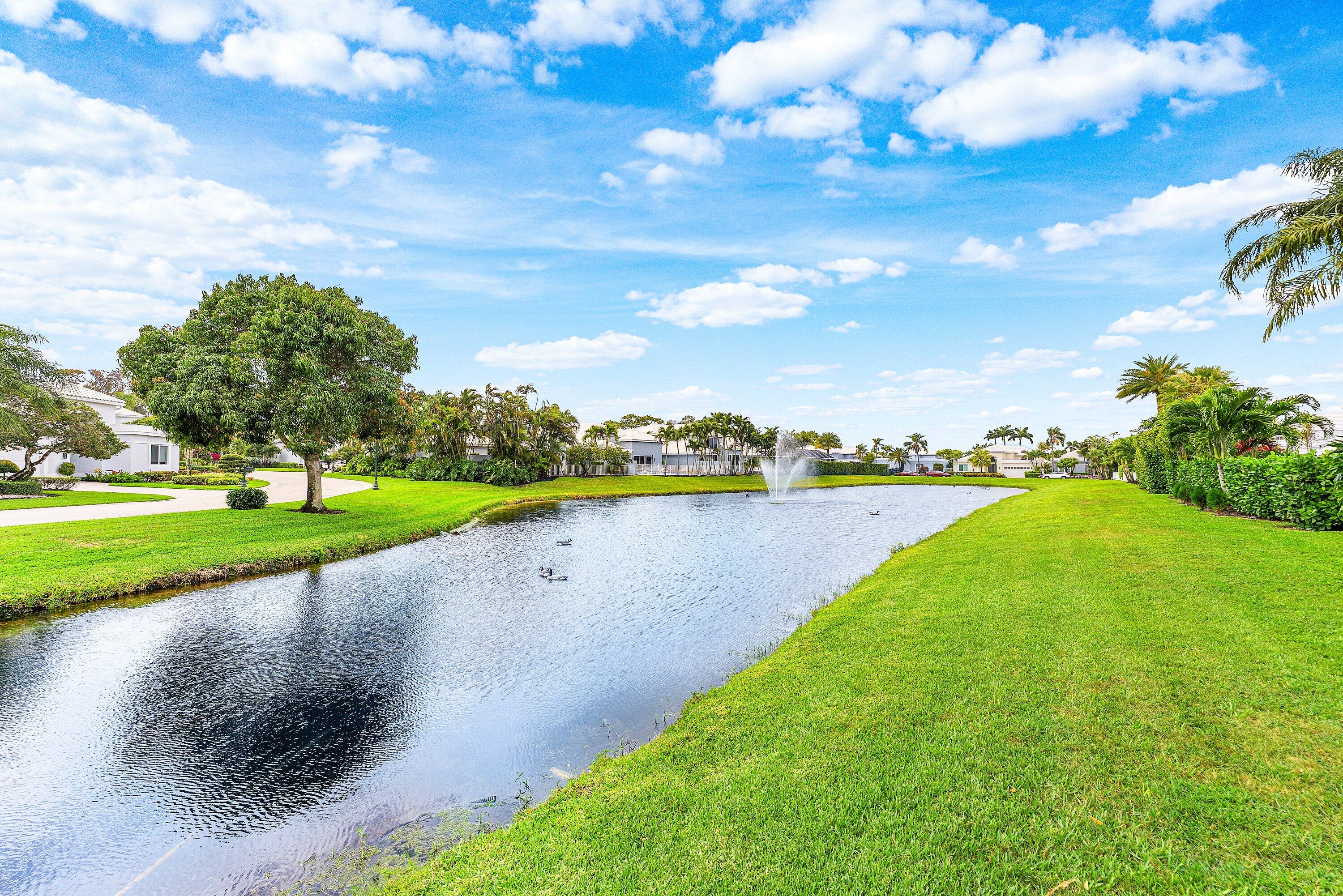 5863 Waterford Boca Raton, FL 33496 - Photo 2 of 90 a view of a lake with houses in the back