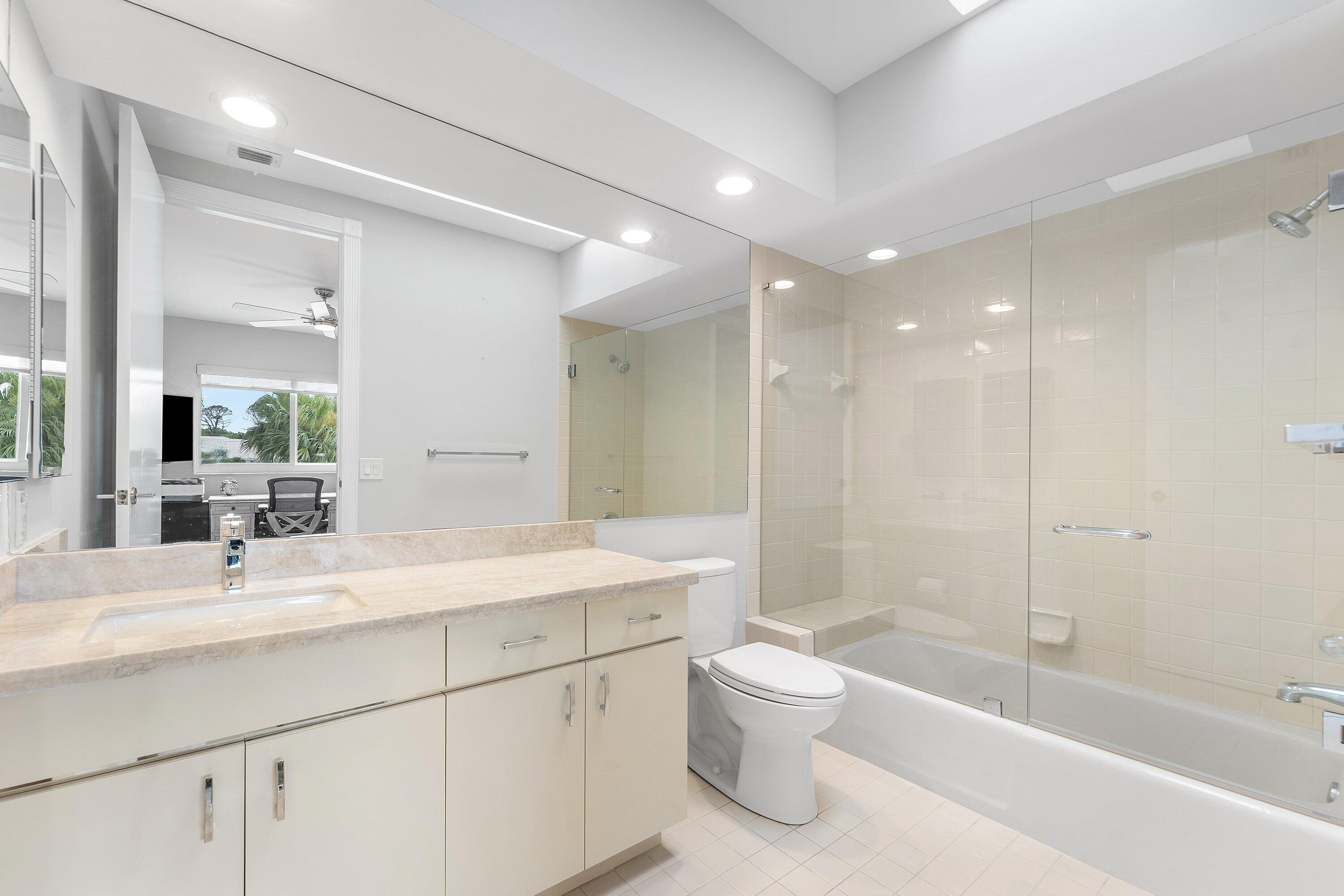 5863 Waterford Boca Raton, FL 33496 - Photo 24 of 90 a bathroom with a bathtub shower sink mirror and toilet