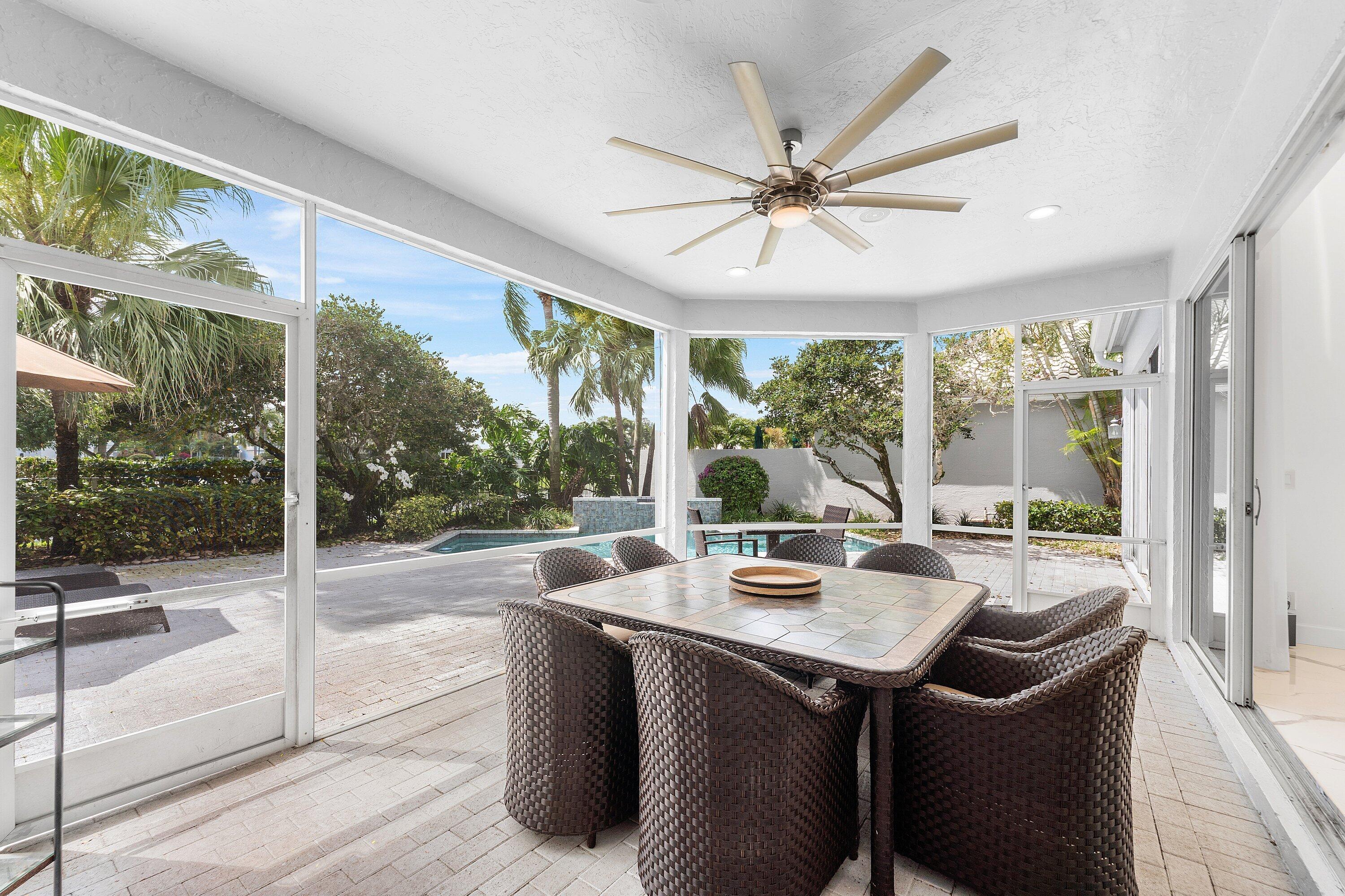 5863 Waterford Boca Raton, FL 33496 - Photo 30 of 90 a view of a dining room with a lot of large windows and wooden floor
