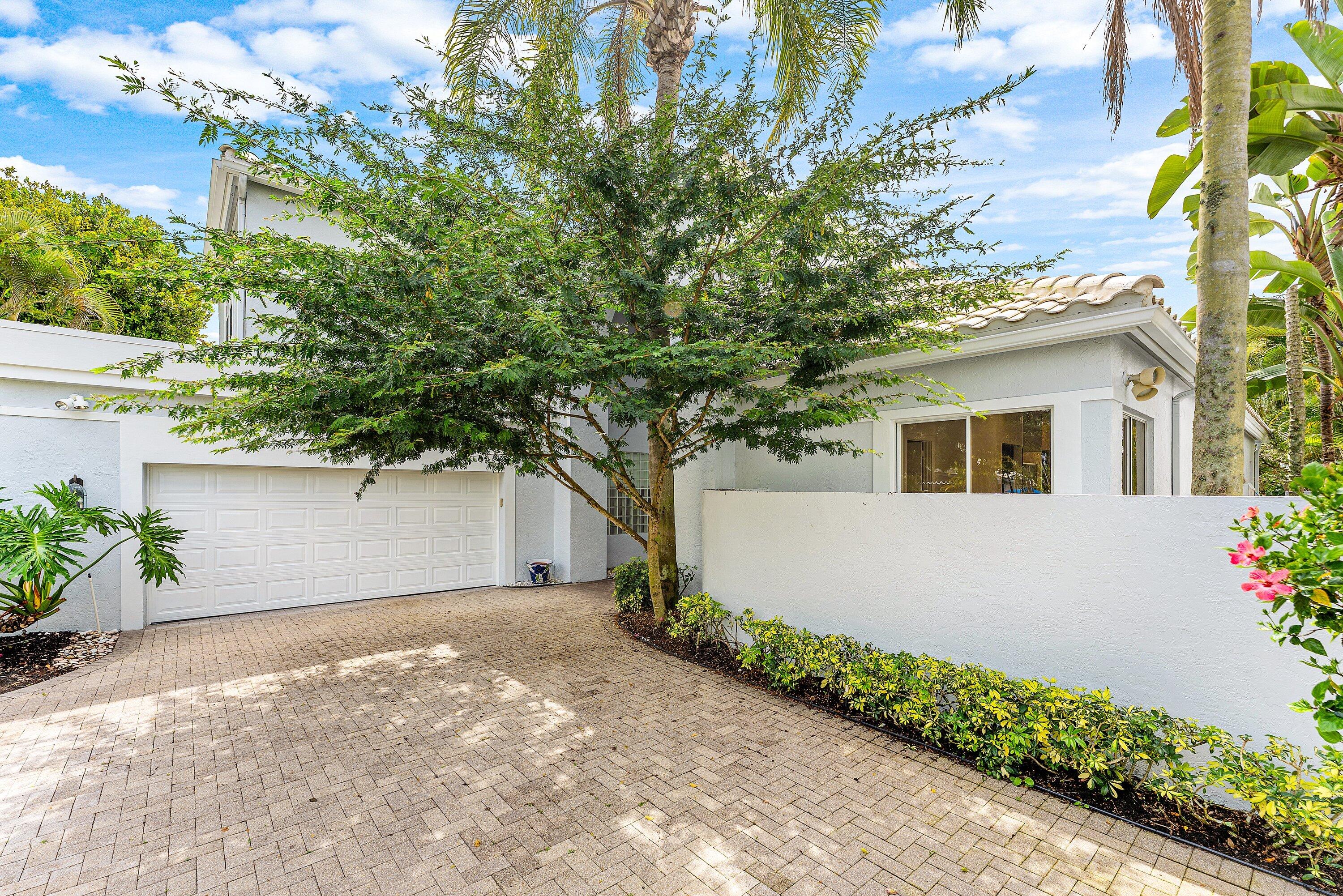 5863 Waterford Boca Raton, FL 33496 - Photo 37 of 90 a front view of a house with a yard