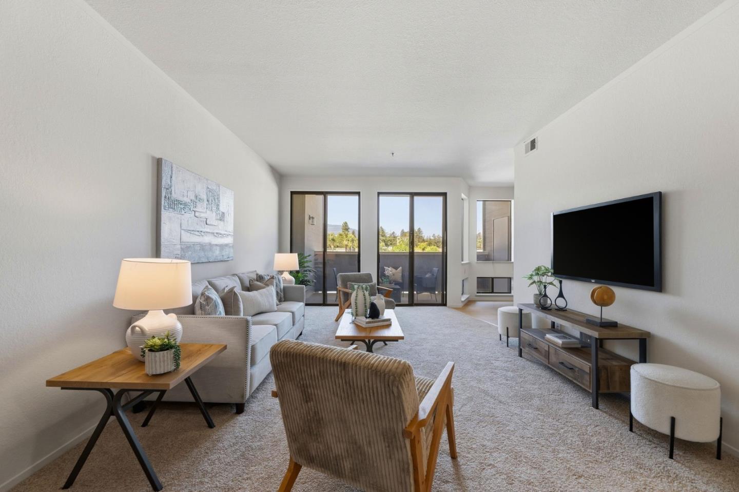 22330 Homestead Road, Unit 226 Cupertino, CA 95014 - Photo 6 of 38 a living room with furniture and a flat screen tv