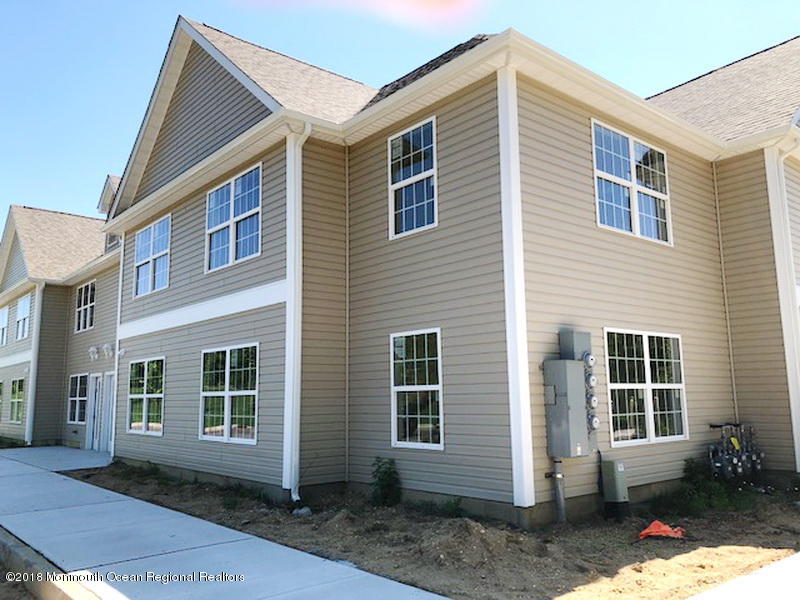 8 Abbey Road Tinton Falls, NJ 07753 - Photo 4 of 6 a view of a house with a yard