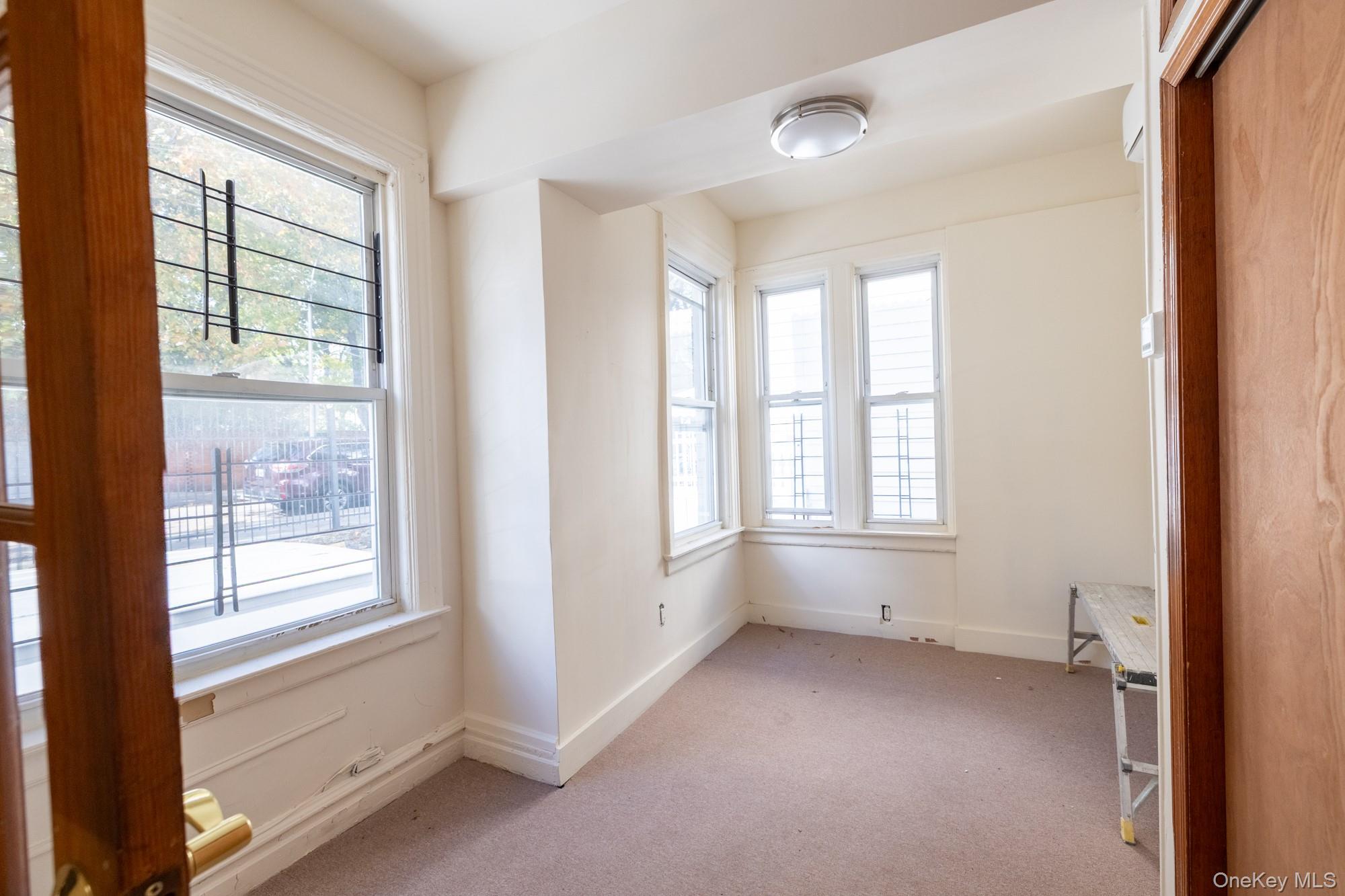 677 Van Nest Avenue Bronx, NY 10462 - Photo 14 of 49 a view of an empty room with a window