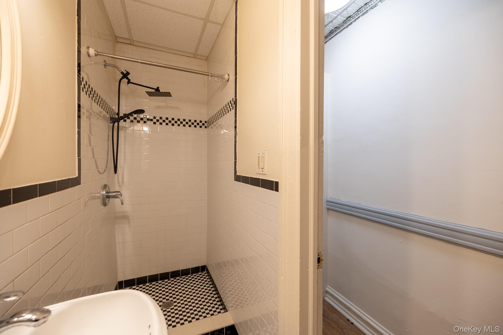 677 Van Nest Avenue Bronx, NY 10462 - Photo 17 of 49 a bathroom with a sink and toilet