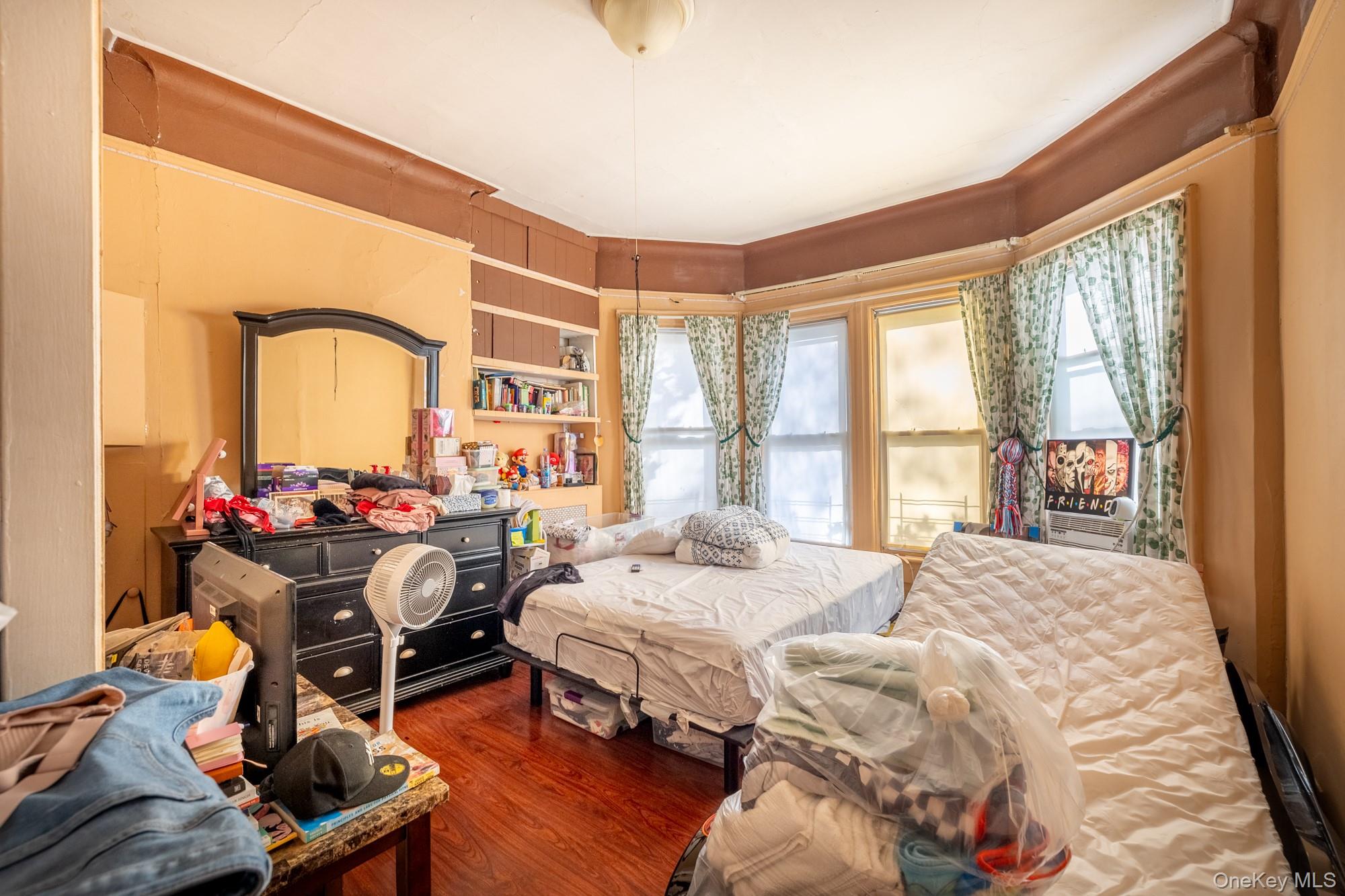 677 Van Nest Avenue Bronx, NY 10462 - Photo 23 of 49 a bedroom with furniture and a window