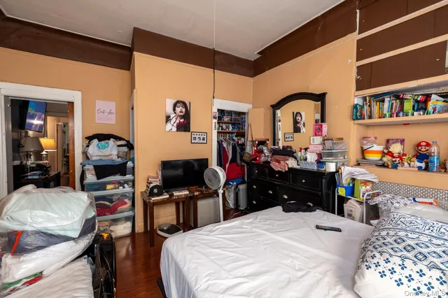 a bedroom with a bed and a closet