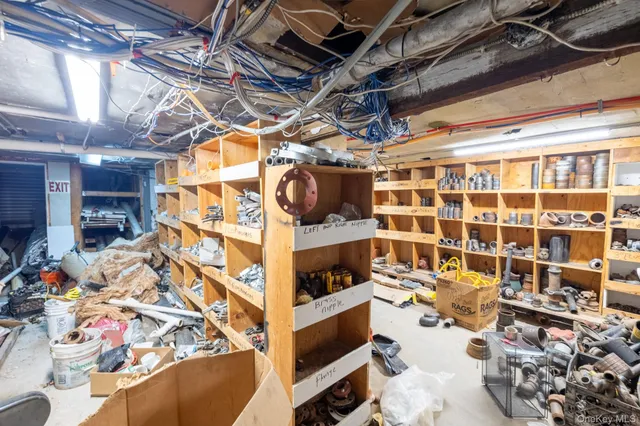 a front view of a building with parking