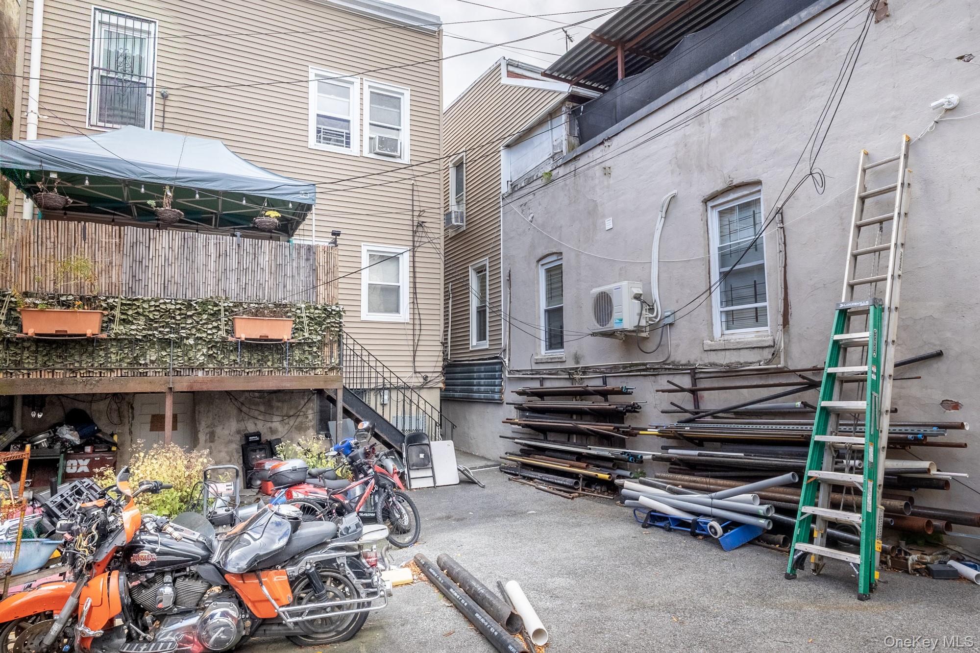 677 Van Nest Avenue Bronx, NY 10462 - Photo 46 of 49 a front view of a house with a garage