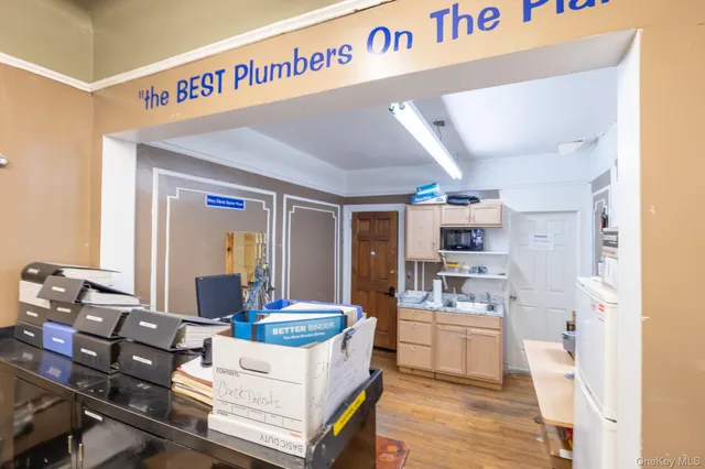 a living room with kitchen island granite countertop furniture and a sink